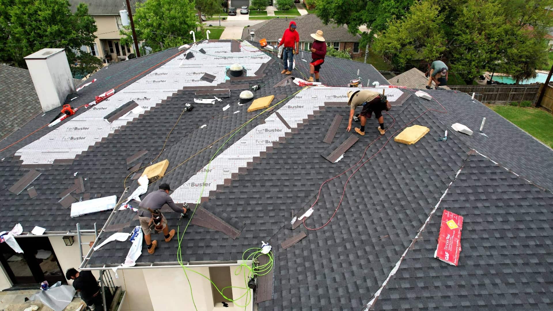 Tex Roof crew installing a new roof on a single-story home in Buda, Texas