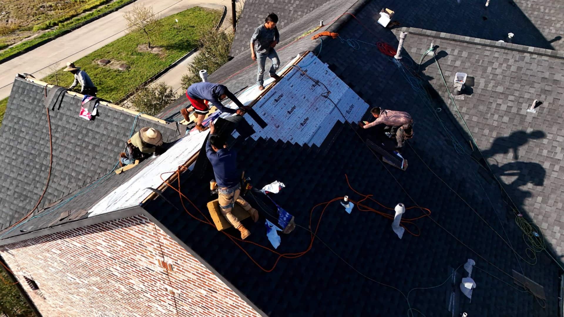 Tex Roof crew replacing a hail-damaged roof on a two-story home in Round Rock, Texas