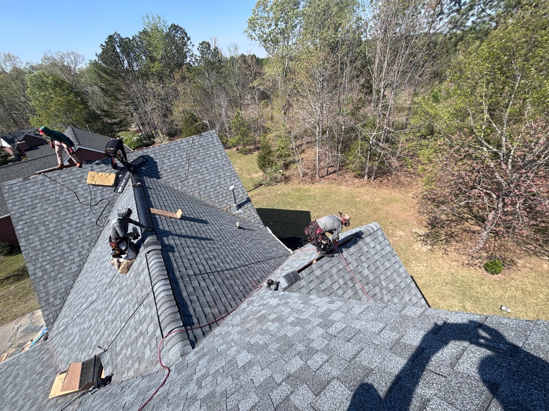 Tex Roof crew installing a new roof on a storm-damaged Austin home