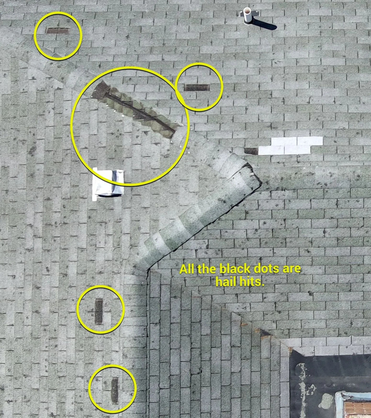 Chalk-marked hail test square and documentation photos on an Austin shingle roof