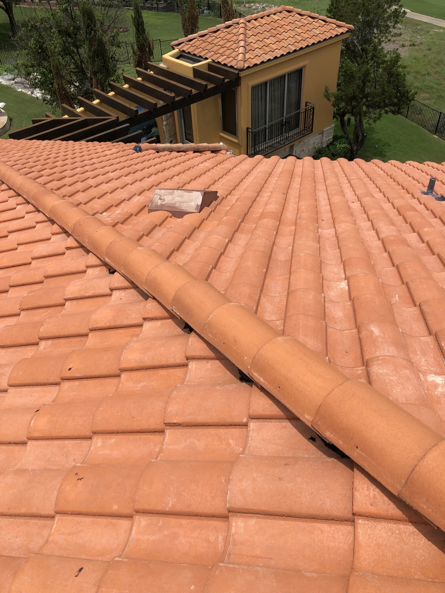 Terracotta clay tile roof on a Mediterranean-style home in West Austin